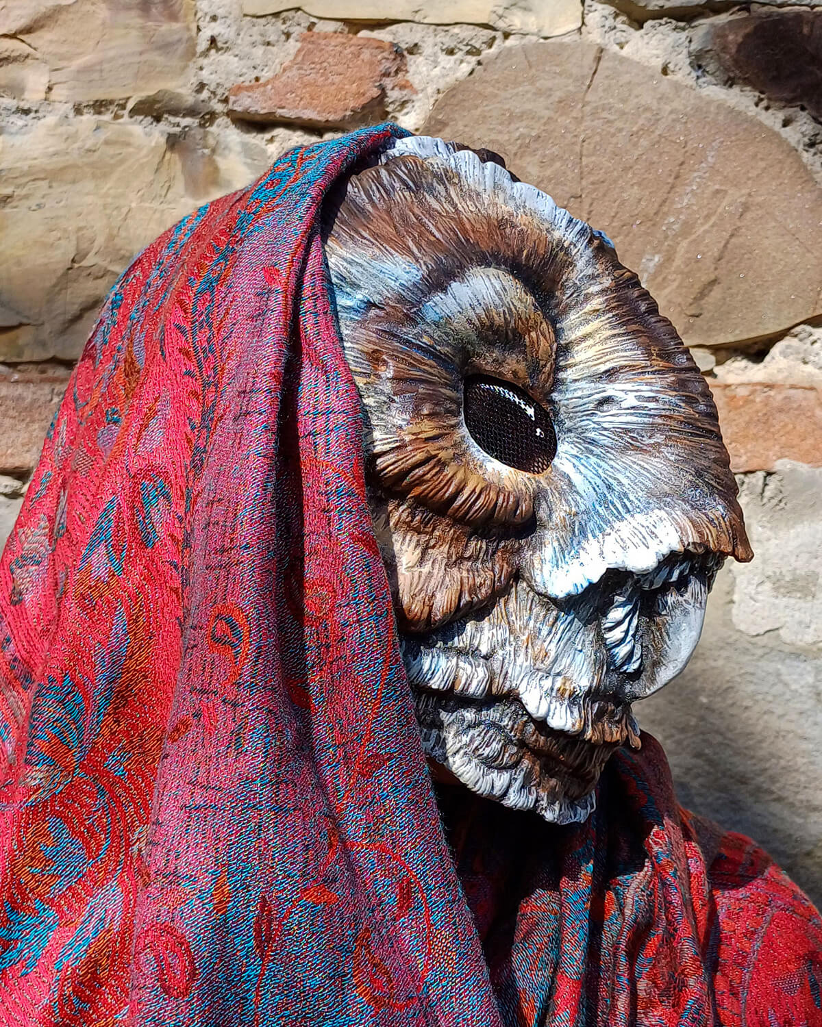 Brown Barn Owl mask being worn, illustrating its fit and appearance for cosplay or a costume event