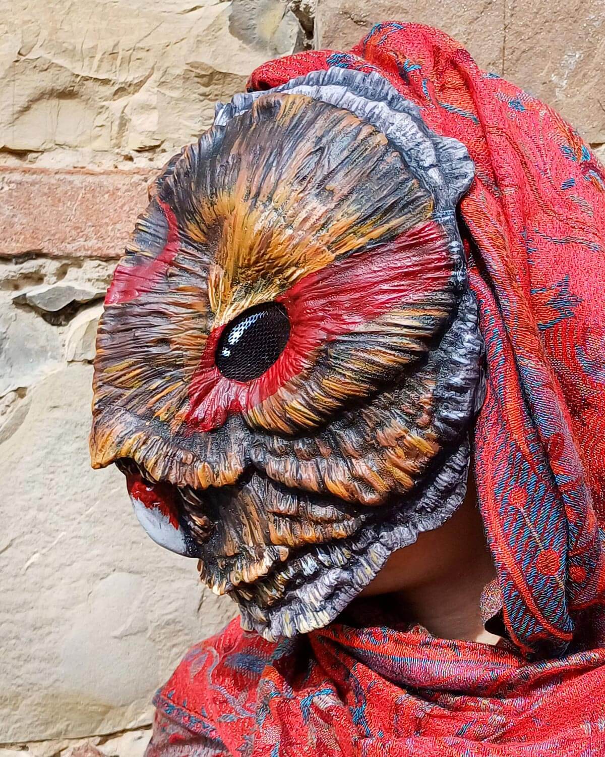 Side view of the Shaman Barn Owl mask, showing the facial contour and the adjustable elastic closure system