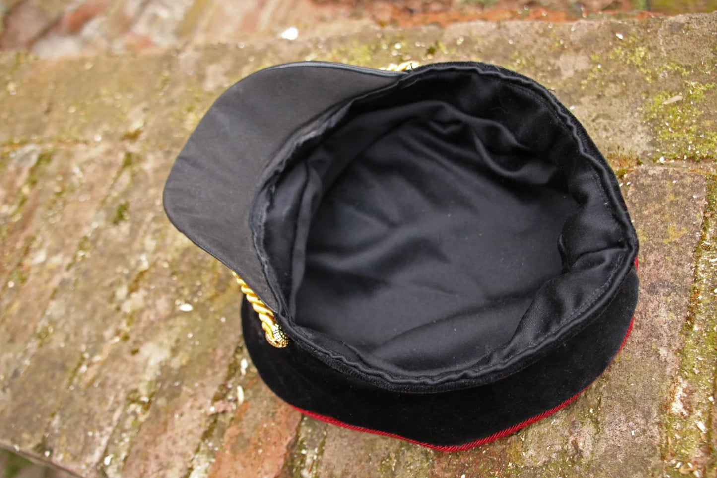 Detailed view of the embroidery on a Warhammer Commissar Cap.
