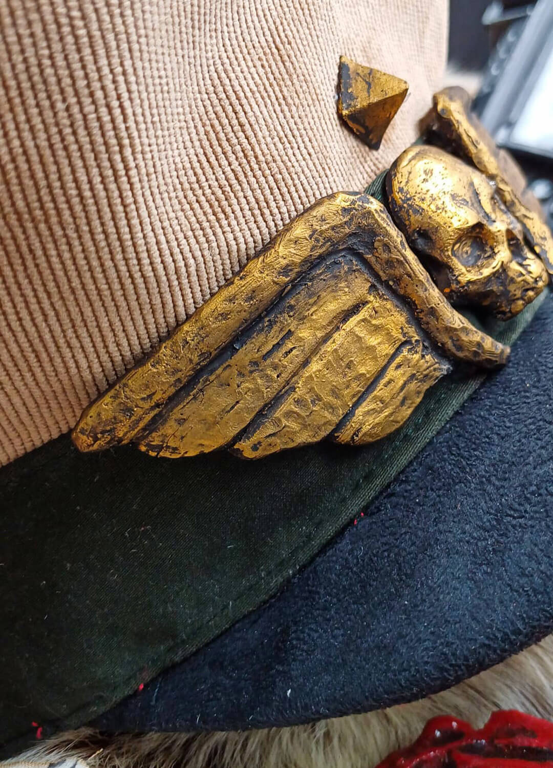 Detailed view of the embroidery on a Warhammer Commissar Cap.