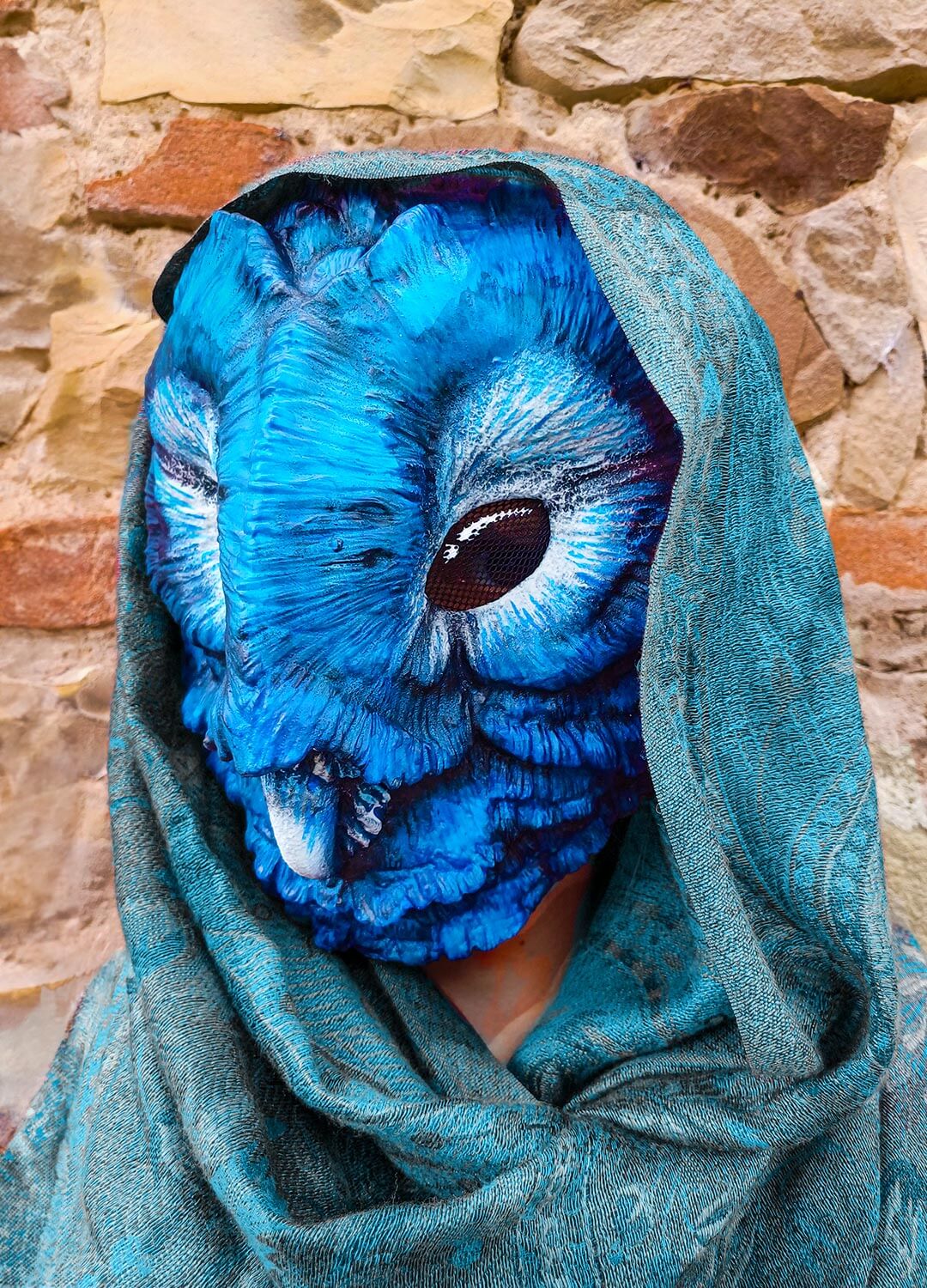 Fatuous Barn Owl mask resting, emphasizing its elegant design and color palette