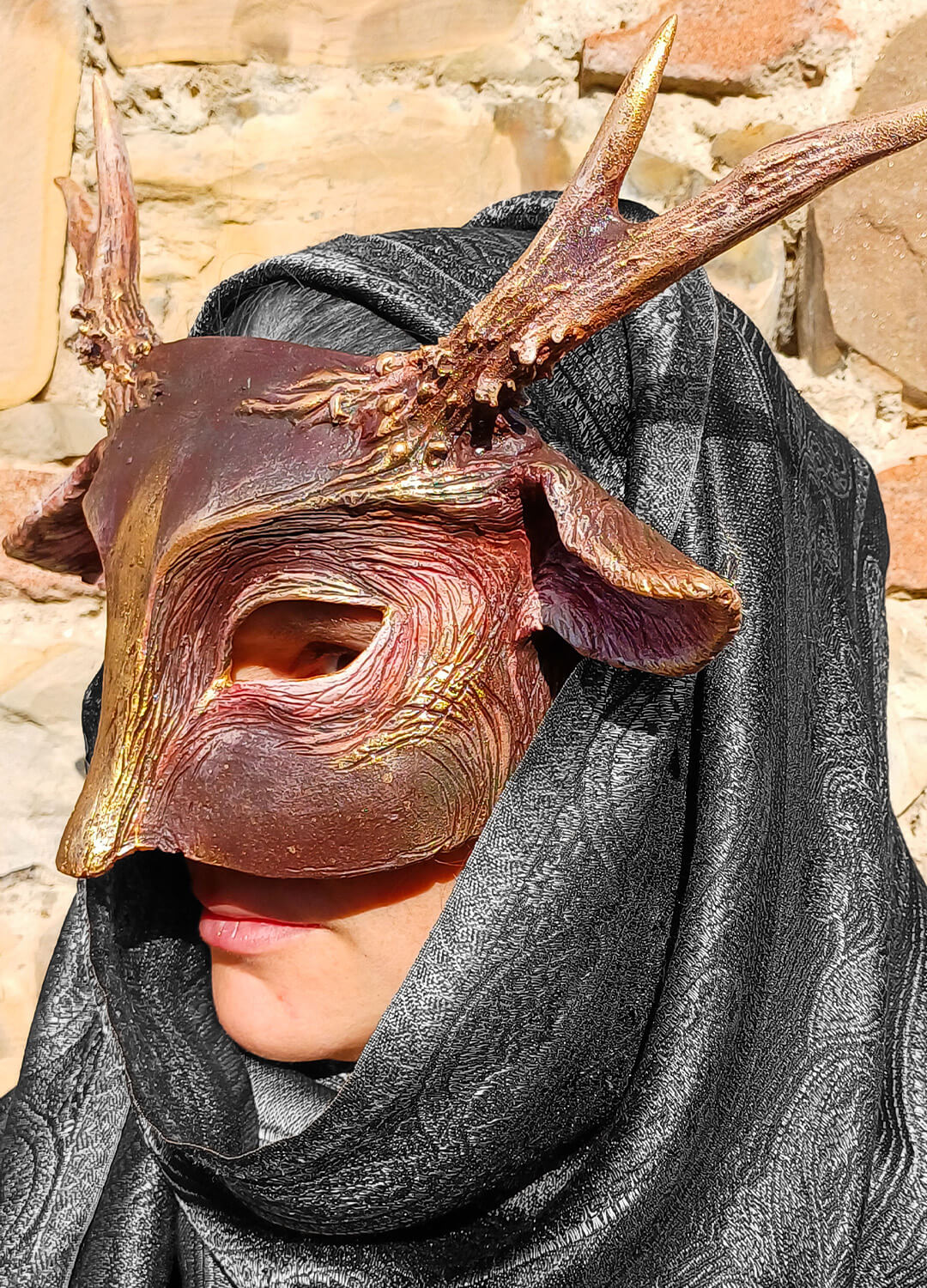 Side view of the Fauno Stone Poet Mask showcasing its nature-inspired design and high-quality craftsmanship.