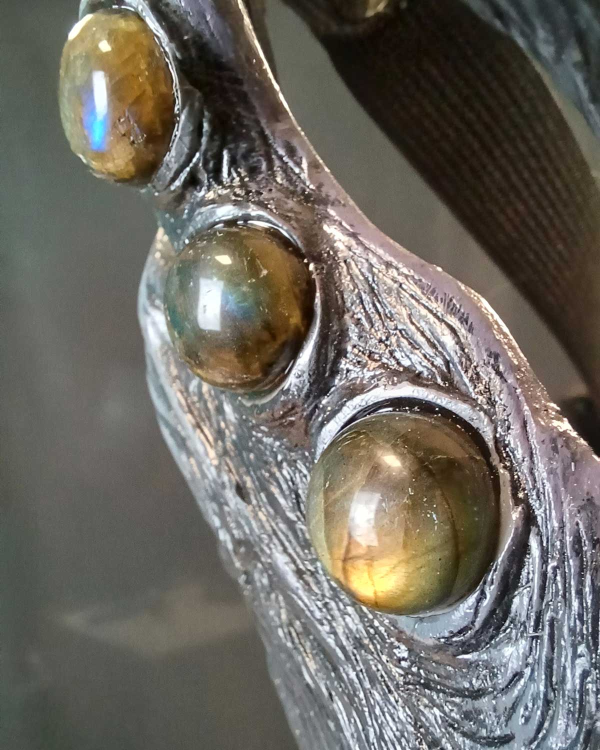 Close-up of an articulated Qilin mask showing the movable jaw feature.