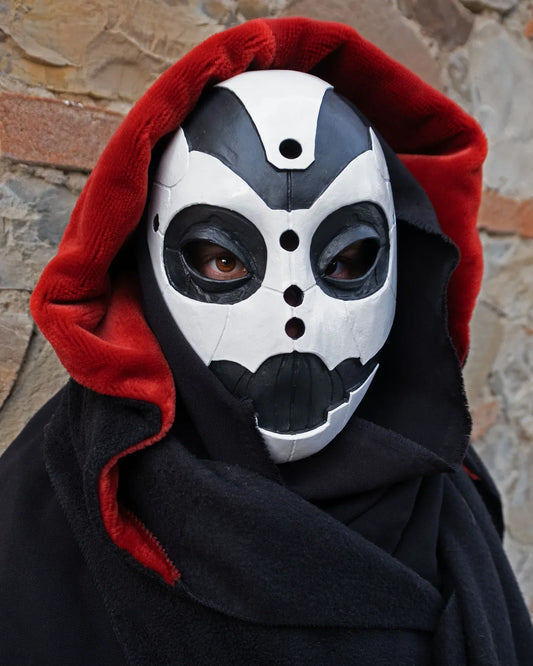 Faceless mask shape of futuristic cyborg made in resin front view black and white