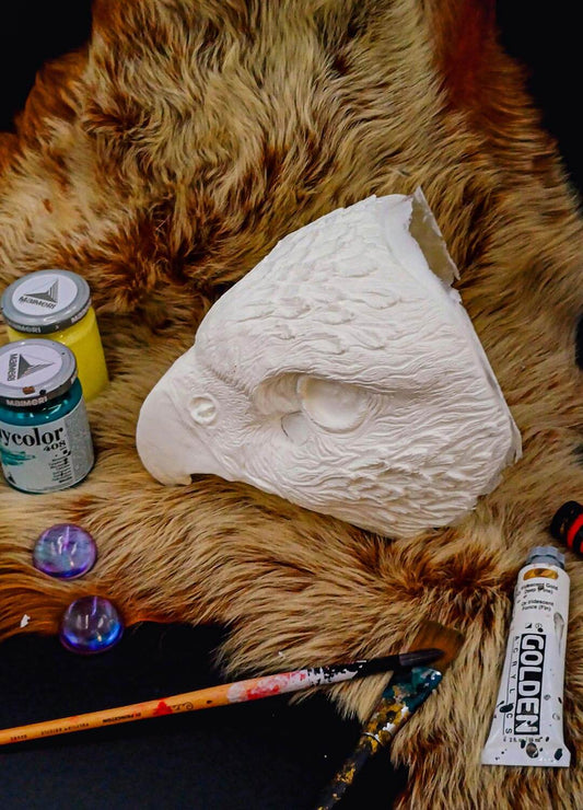 Close-up of the resin texture on the blank Hawk mask, showing details for painting and customization.