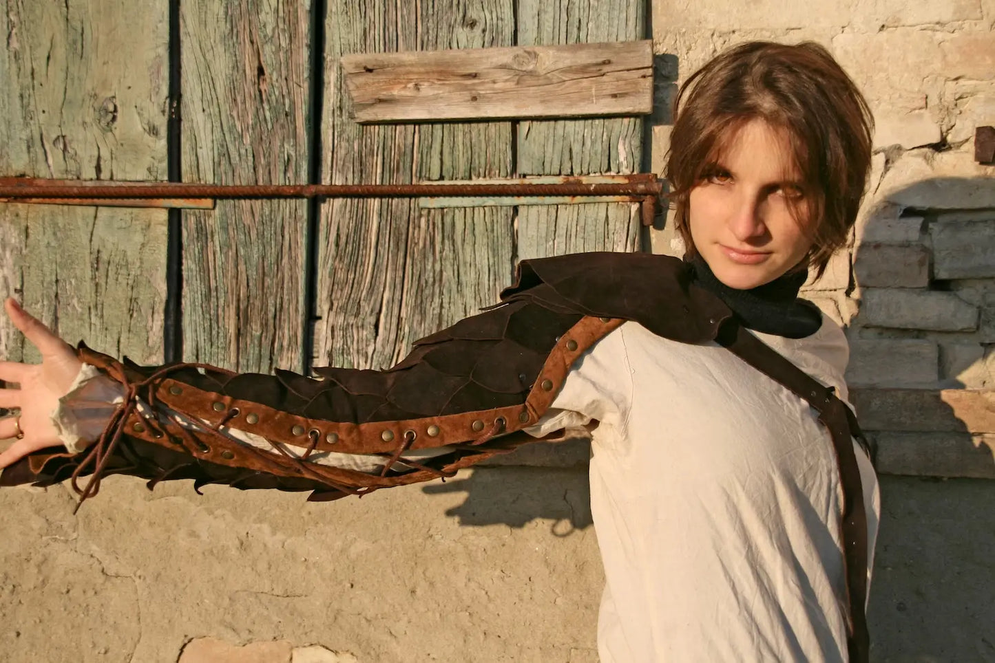 Close-up of a handmade leather gladiator bracelet, showcasing the stitching and design details, ideal for a cosplay costume.
