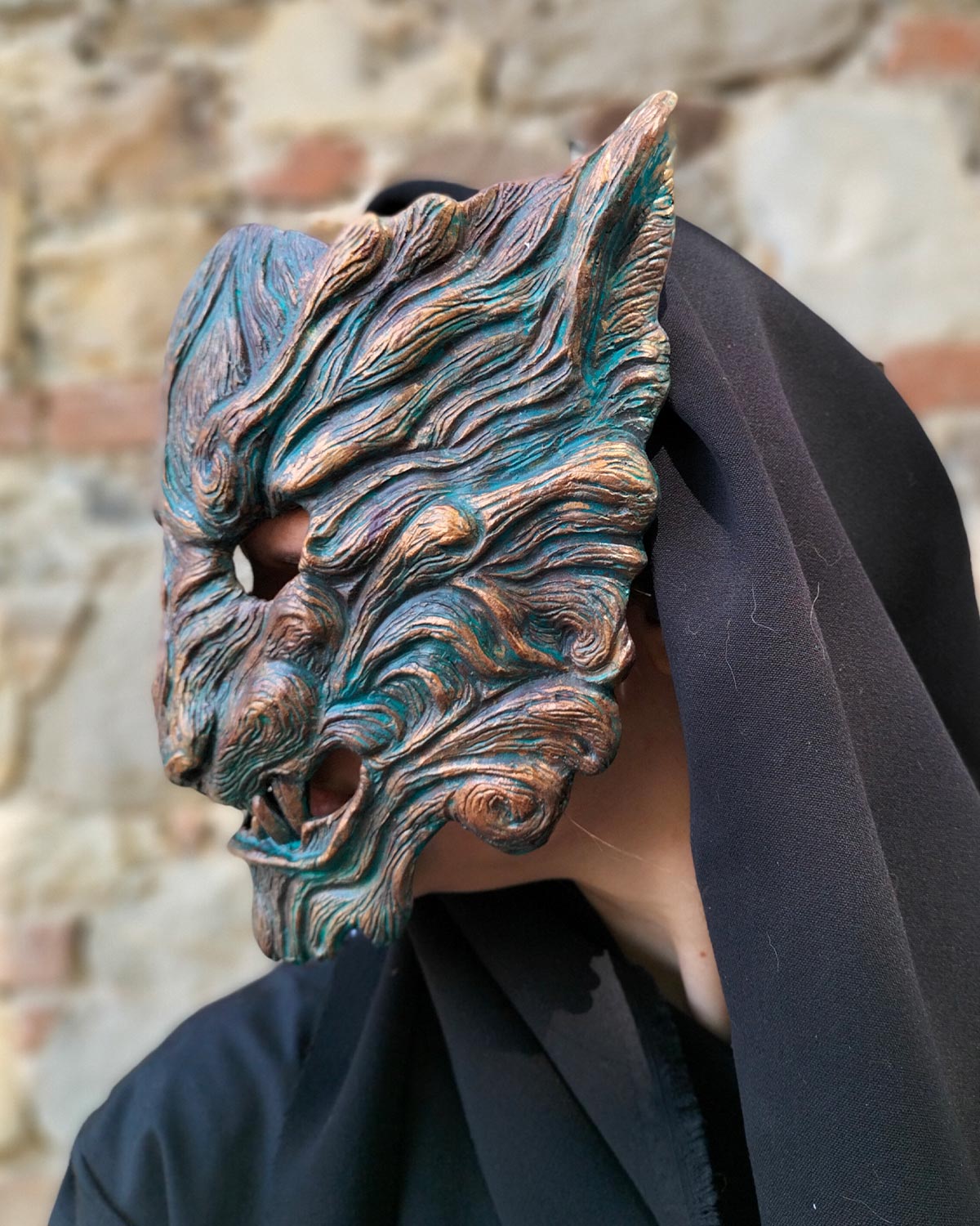 Left side view of handcrafted tiger mask with captivating oxidized colors, with details on color