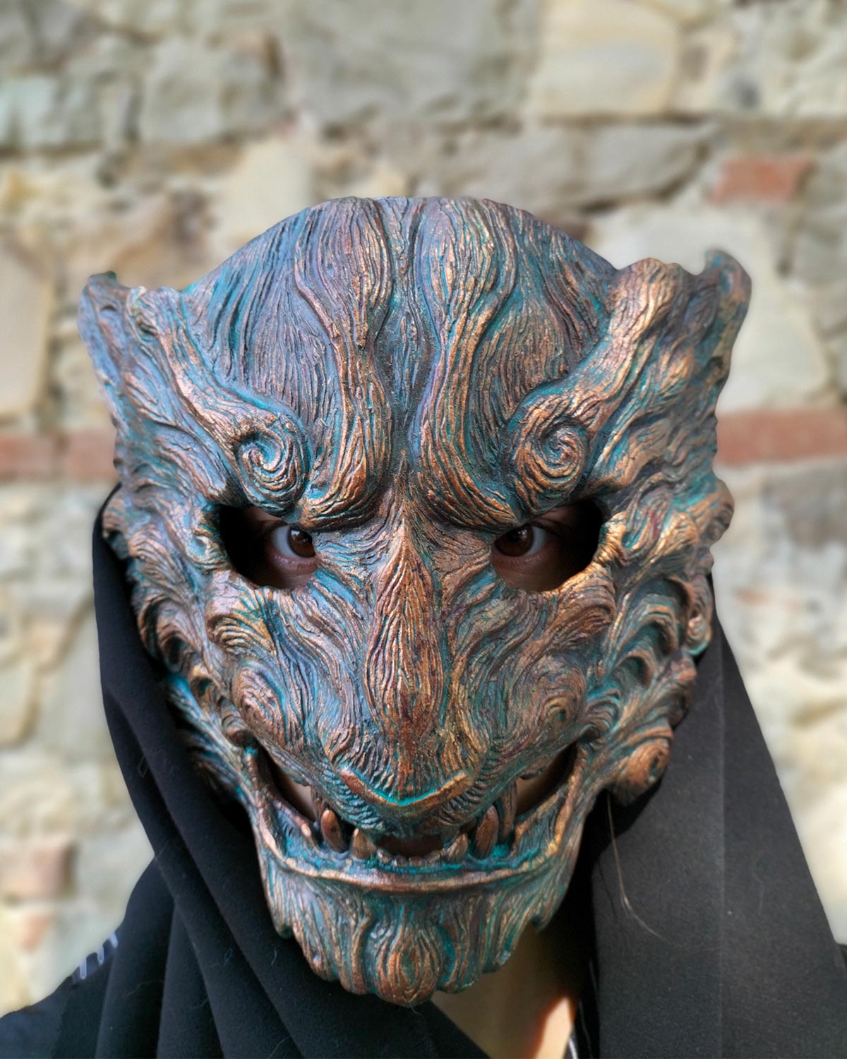Front view without cap of handcrafted tiger mask with captivating oxidized colors