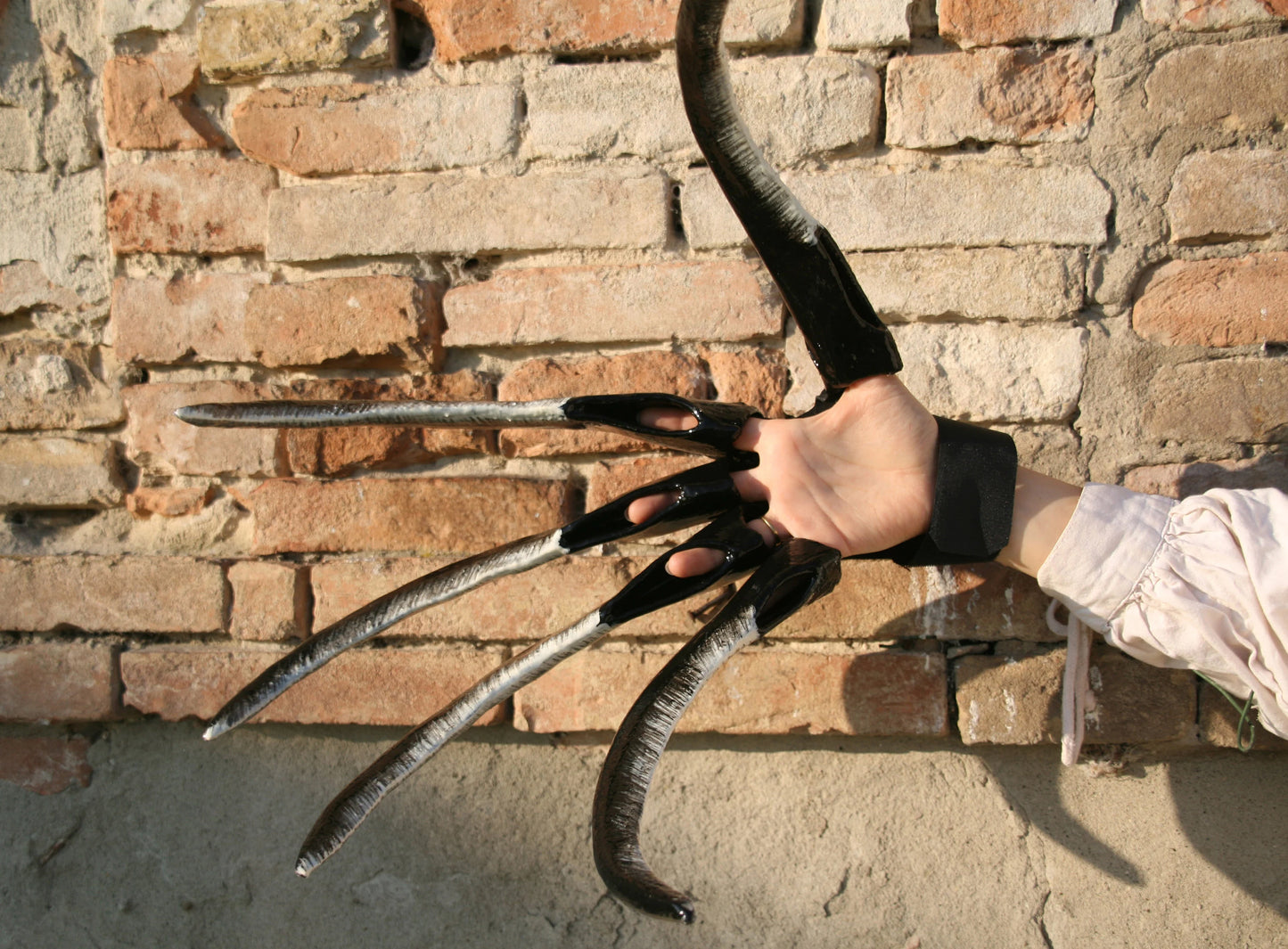 Demonstration of the comfortable wear of the finished claws, showing bent fingers and ease of movement for cosplay or LARP activities.