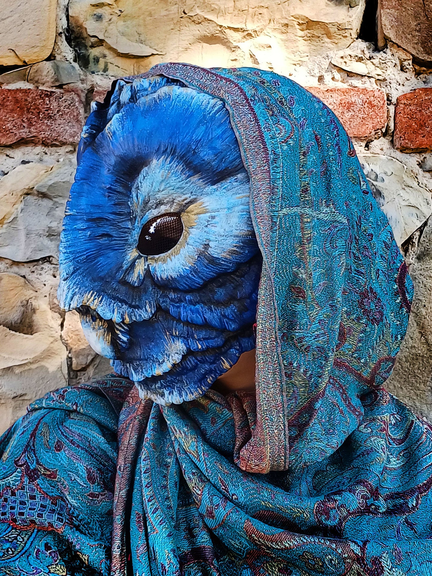 Regal Barn Owl mask being worn, highlighting the glowing eye effect in a costume context.
