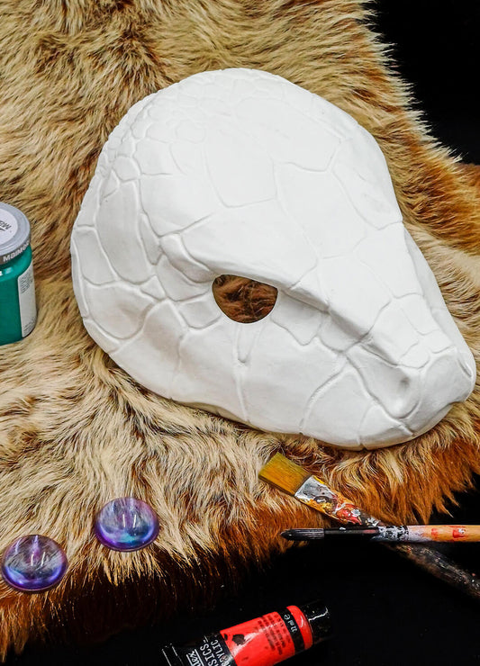 Smooth, pre-sanded surface of the snake mask, showing details ready for paint.