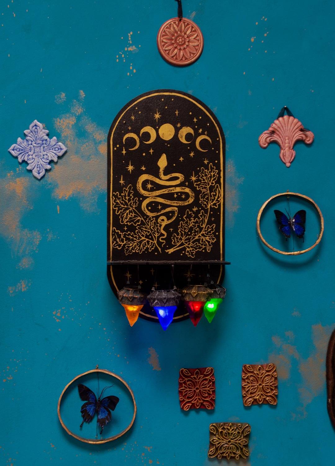 Handmade gothic wooden necklace holder, front view, intricate carvings and hand-painted details.