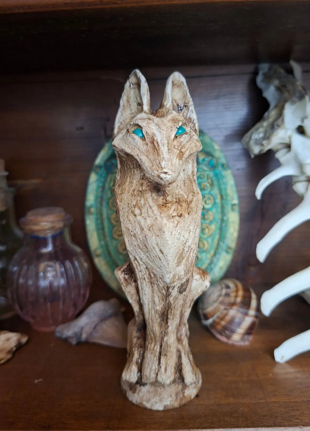 Tribal wolf Ancient Idol featuring blue custom eyes and bone-inspired texture.