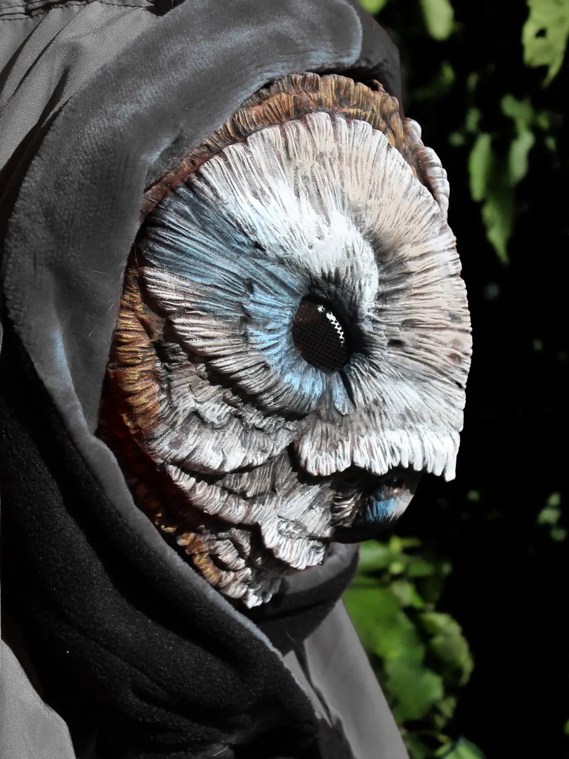 Grey and blue barn owl mask on side view perfect for LARP and cosplay