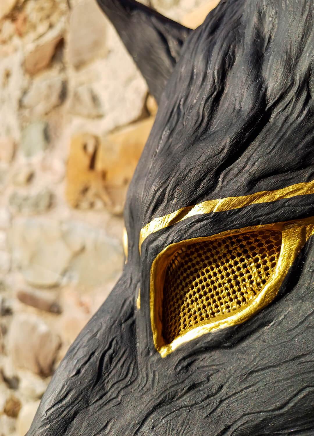 Detail of the eyes and possible Egyptian-inspired decoration on the Fenrir wolf mask