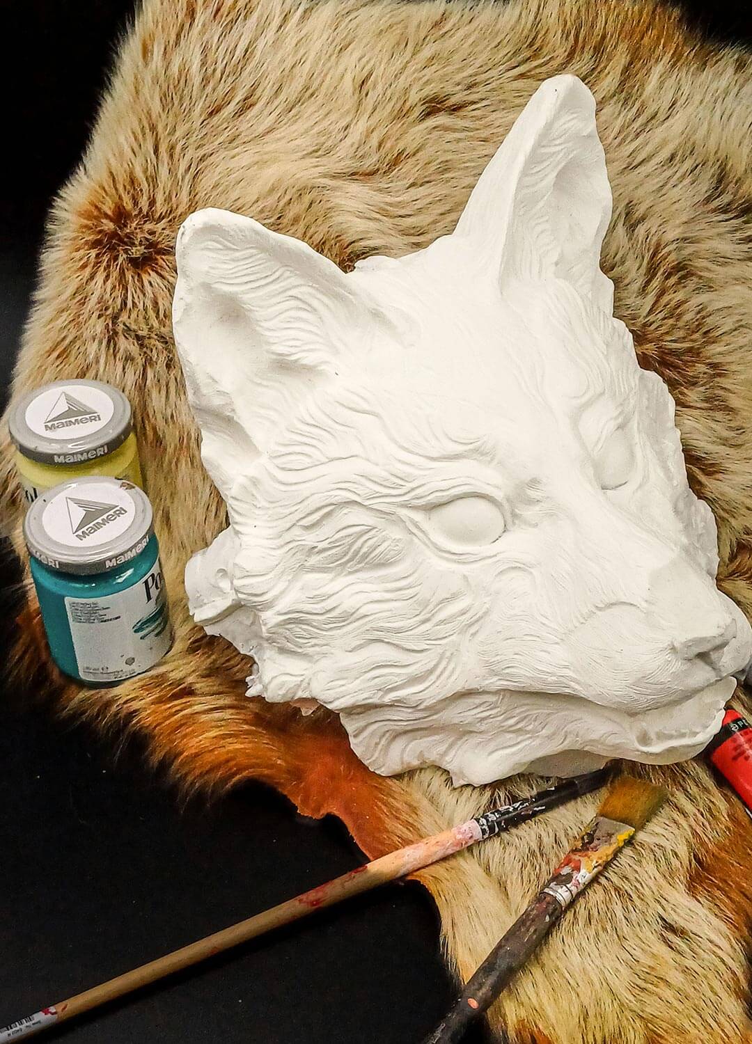 Close-up of resin texture on Huli Jing mask, showing smooth, pre-sanded surface.