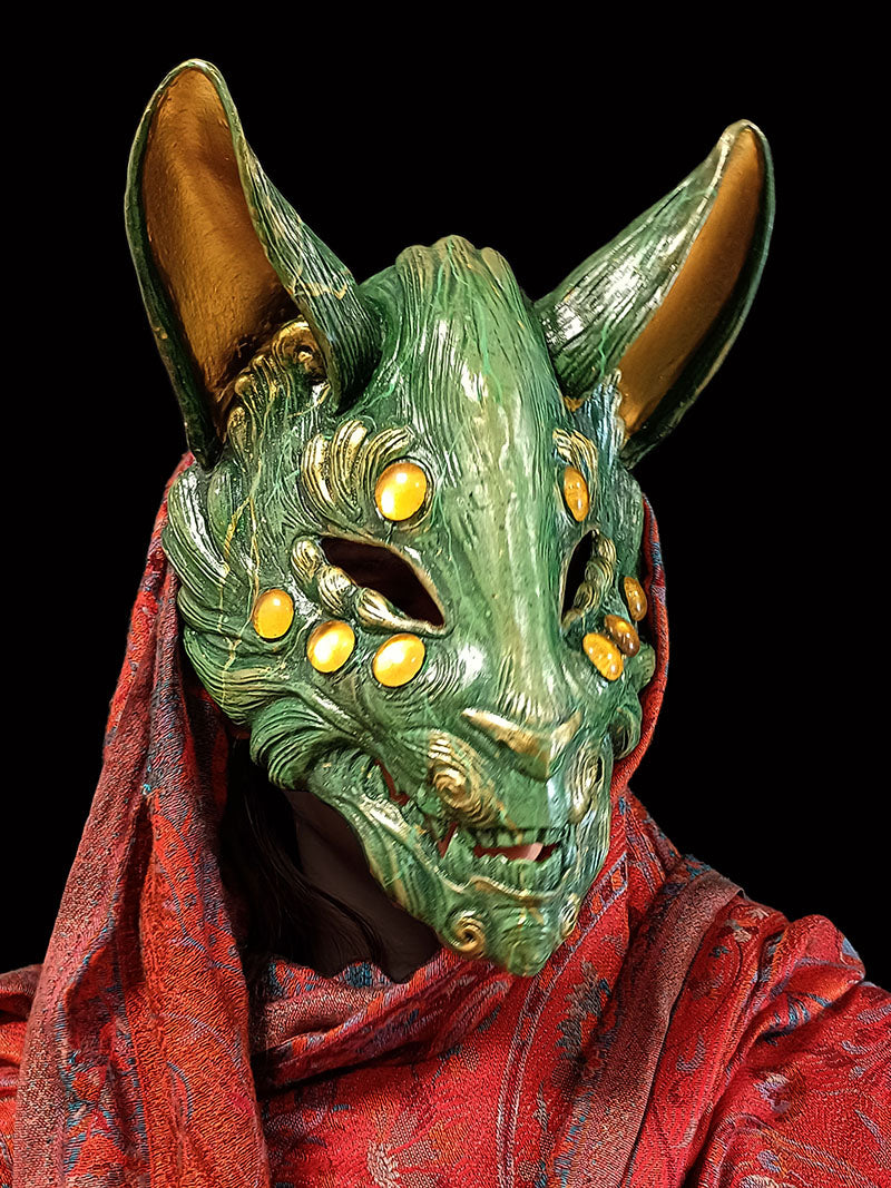 Handcrafted jade resin Kitsune mask inspired by Japanese folklore.
