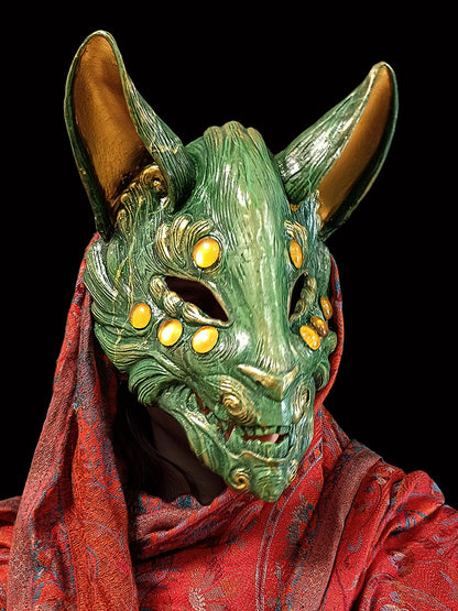 Handcrafted jade resin Kitsune mask inspired by Japanese folklore.
