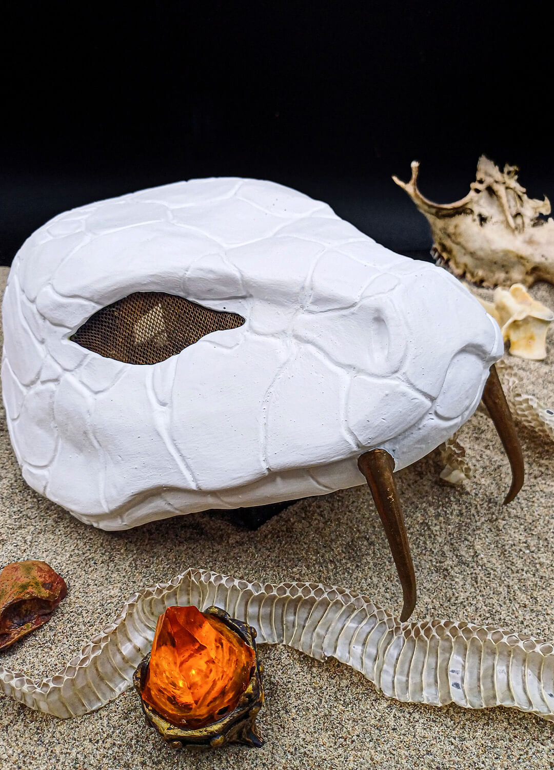 Detail shot of the Nara Desert Snake Mask – Bronze mesh eye cover for visibility