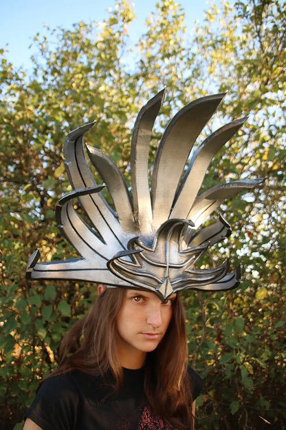 Side view of lightweight silver foam headdress with rubber-coated sunburst design – ideal for theatrical and music performances.