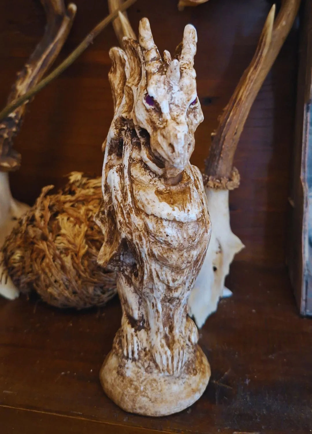 Front view of the majestic Gargoyle Dragon sculpture, showcasing its powerful chest, muscular limbs, and defensive posture.