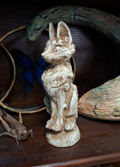A small kitsune fantasy idol sculpture made of high-quality resin with a realistic porous aged wood finish, inspired by mythological creatures and folklore.