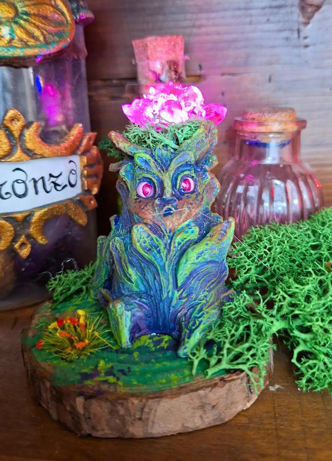Crimson Bloom Lumen Mandrake featuring a red glowing flower and handcrafted botanical details.