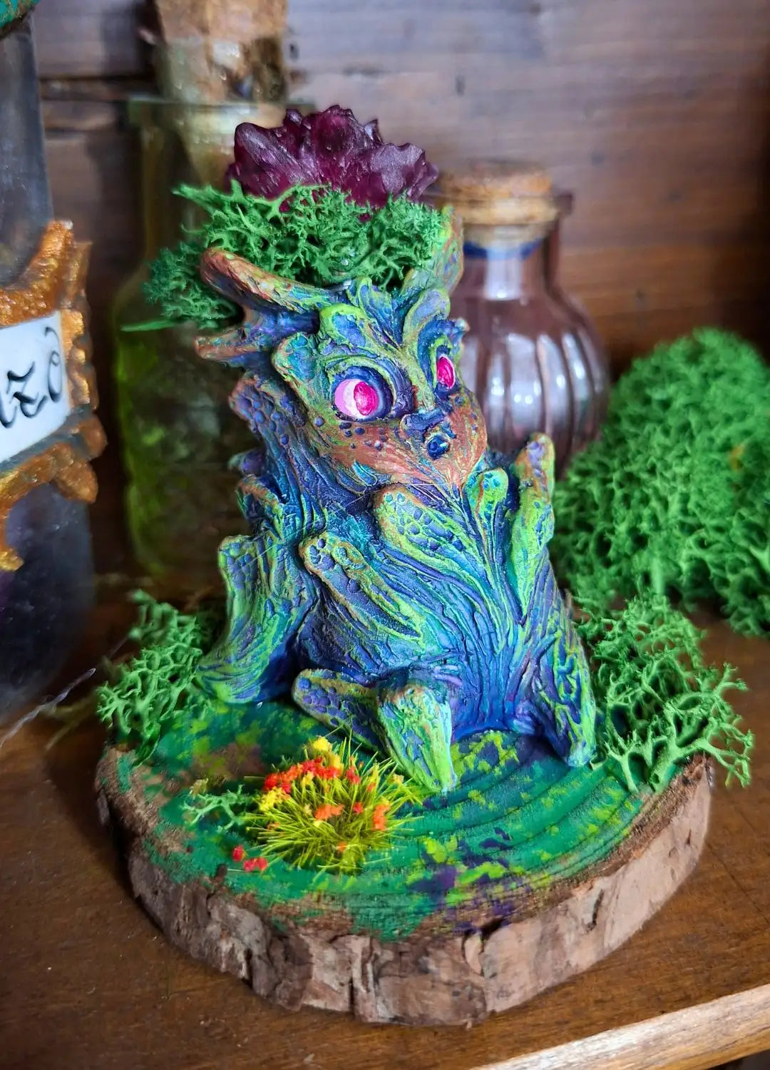 Close-up detail of the glowing resin flower on a Lumen Mandrake fantasy plant.