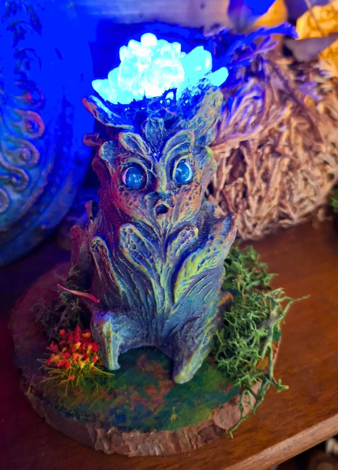 Moon Bloom Lumen Mandrake with blue illuminated flower and fantasy botanical design.