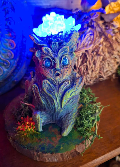 Moon Bloom Lumen Mandrake with blue illuminated flower and fantasy botanical design.