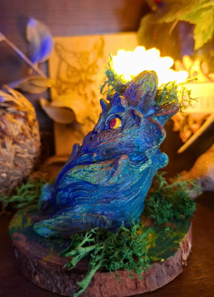Side view of a Lumen Mandrake fantasy sculpture showing botanical textures and glowing flower.