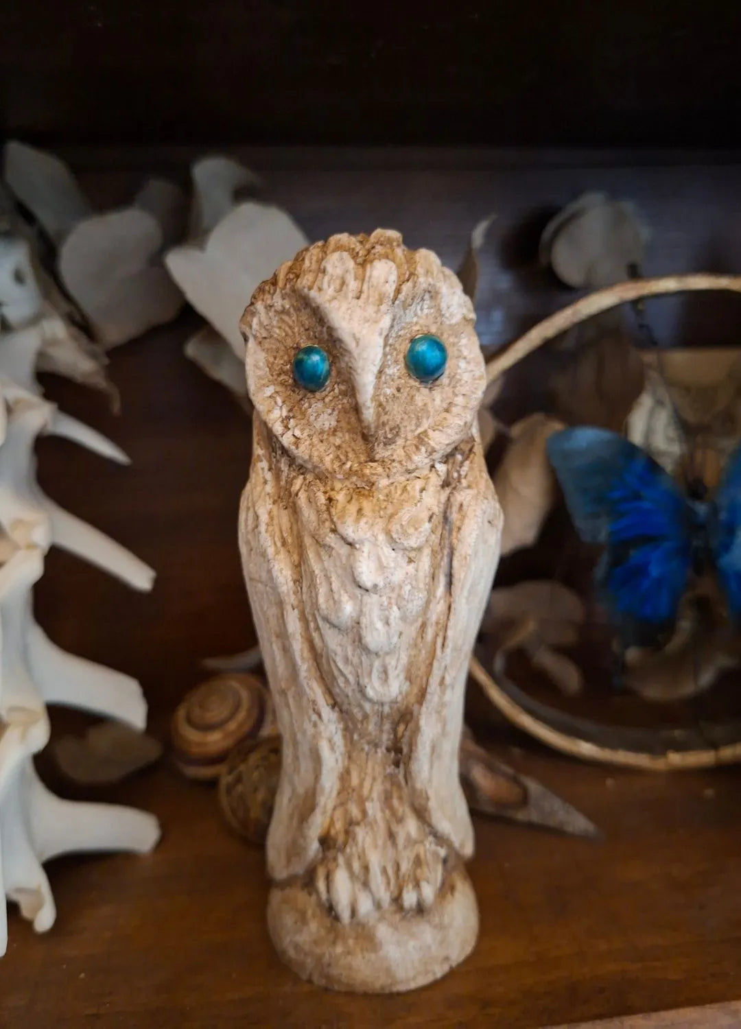 Mystic Owl Ancient Idol with blue eyes inspired by mythical creatures and fantasy relics.