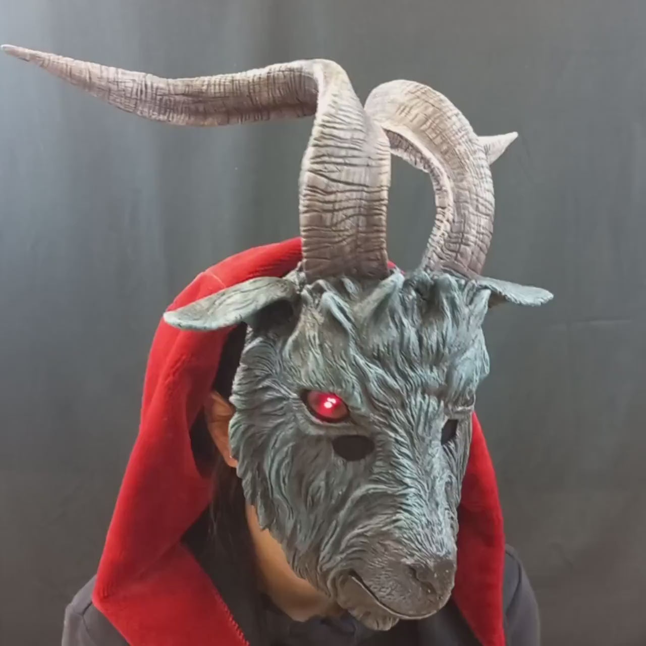 Lifelike goat mask with detailed horns, LED illuminated eyes, customizable fur color, made from durable resin, perfect for costume parties and themed events.