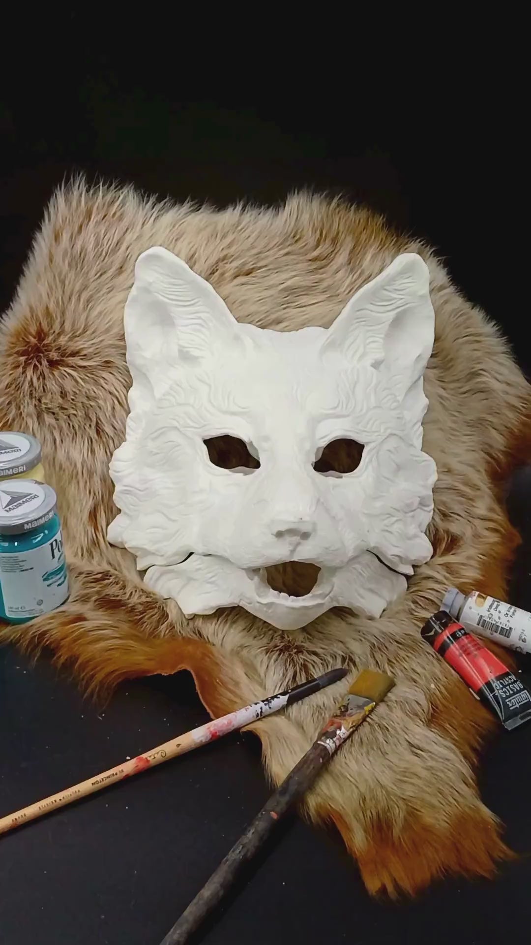 Huli Jing mask blank with articulated jaw, showing movable parts.