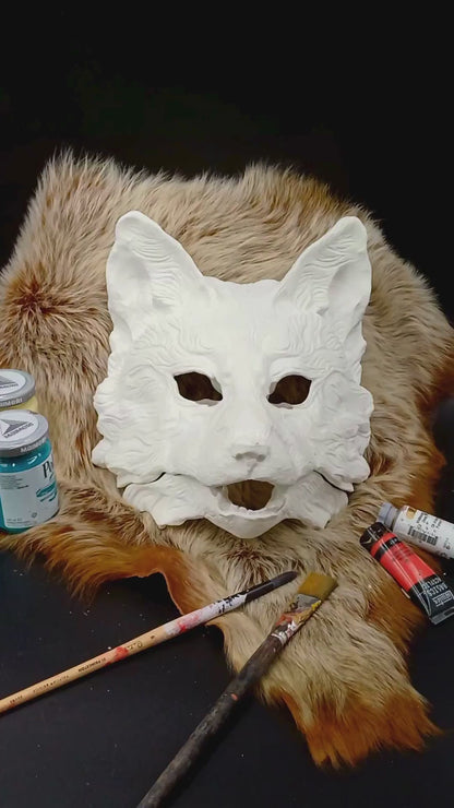 Huli Jing mask blank with articulated jaw, showing movable parts.