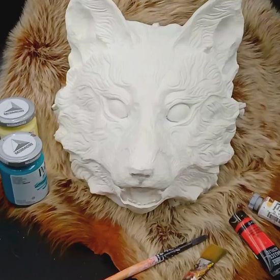 Side view of Huli Jing fox mask, highlighting the mask's shape and design.
