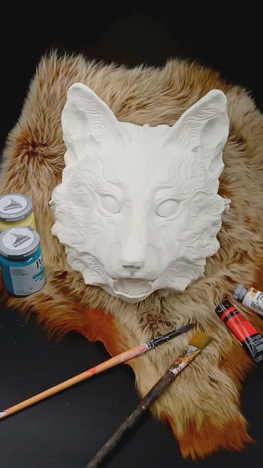 Side view of Huli Jing fox mask, highlighting the mask's shape and design.