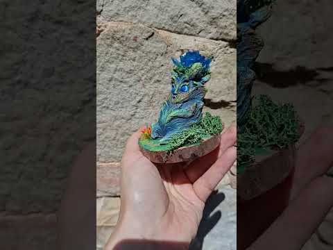 360 degree view of the handmade Lumen Mandrake fantasy plant collectible with glowing flower.