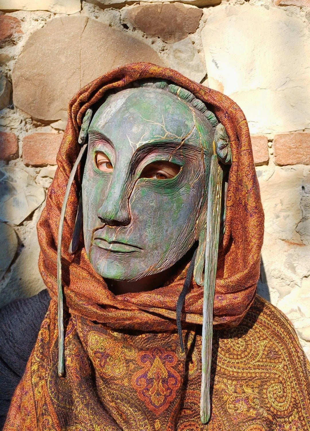 artisan resin mask with golden kintsugi cracks for cosplay and theater