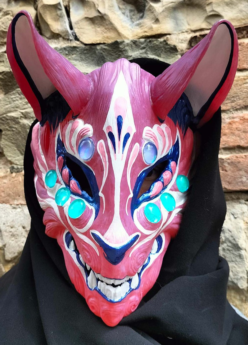 sunlight-activated Kitsune mask ideal for cosplay and outdoor events.
