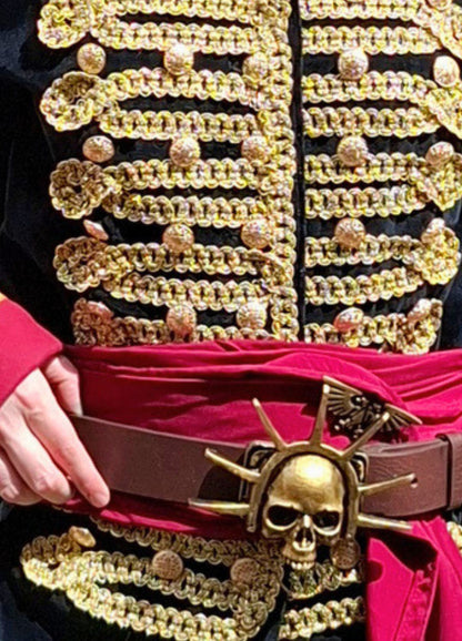 Close-up of a premium Italian velvet Warhammer 40k commissar coat with ornate gold military trim and solid metal buttons.