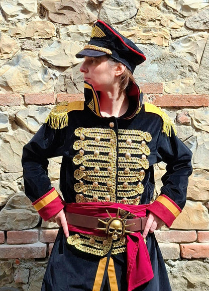 Full Astra Militarum Commissar costume set by Chimerical Dragonfly featuring custom tailored velvet coat, lined hat, red sash, and leather belt.