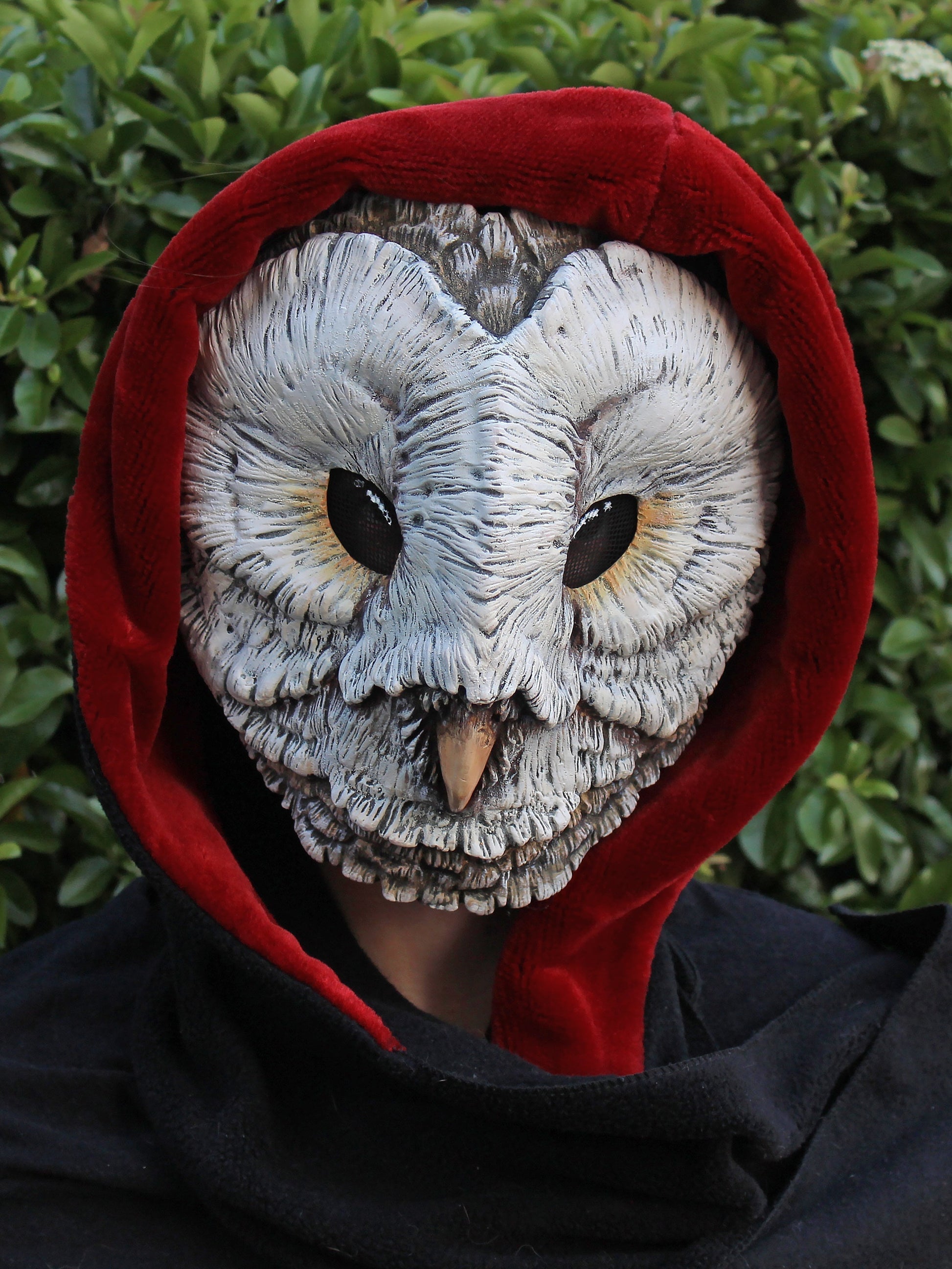 white barn owl mask made in resin for renaissance festival masks with red hood
